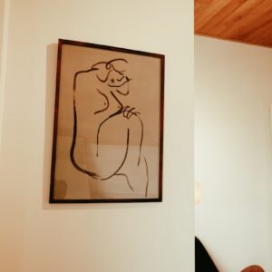 A picture hanging on the wall of a living room