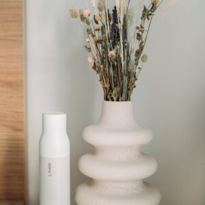 white ceramic vase with flowers